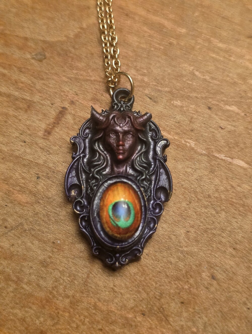 Resin Demon Lady With Colorful Cabochon In Center On Gold Tone Chain Necklace